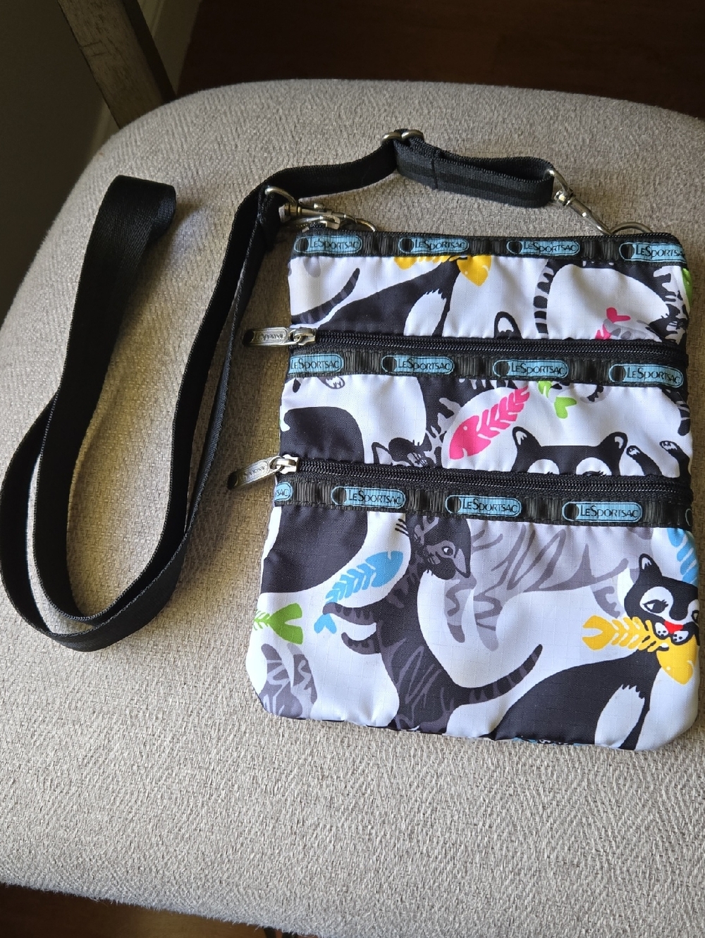 LeSportsac White & Black Cat Print Crossbody with Multi-Colored Feathers